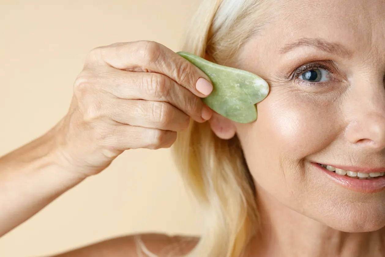 benefits of gua sha mature blonde woman